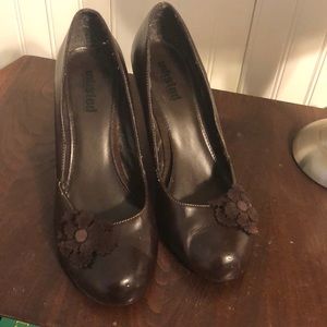 Brown heels with flower.